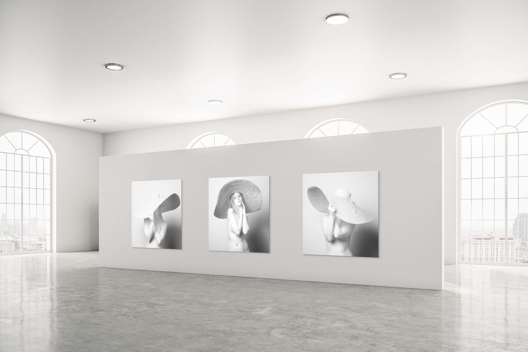 A triptych of photographs from the Porcelain series by Kofi Amoa, framed on a gallery wall