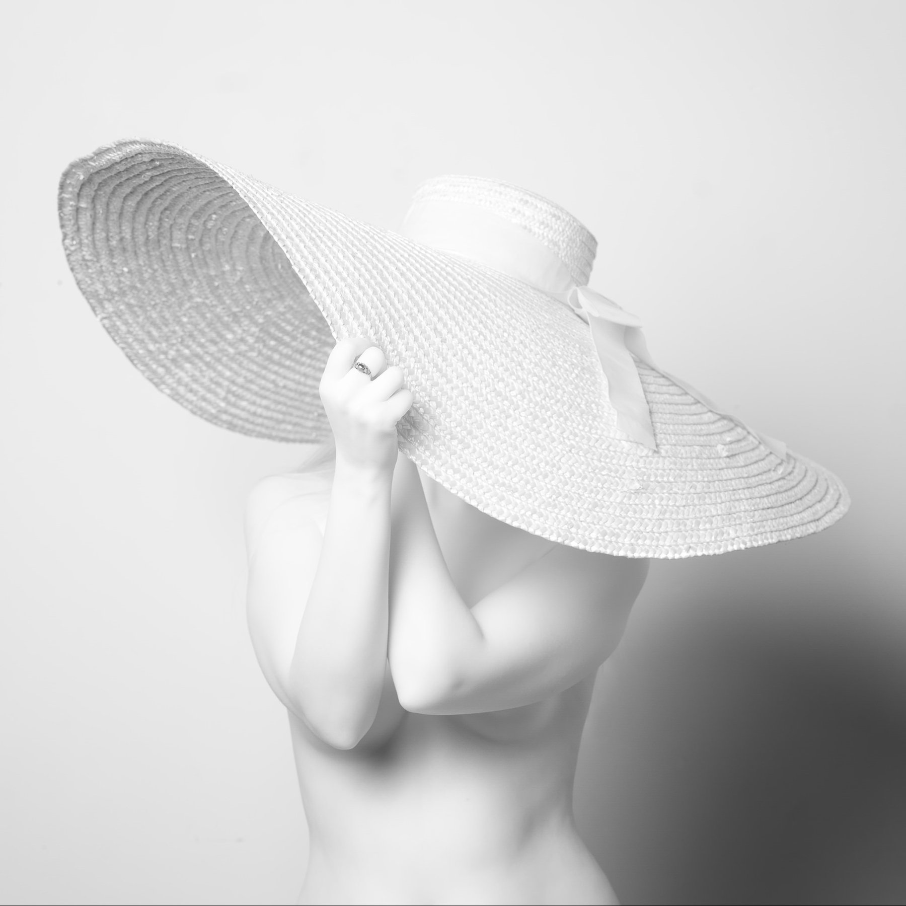 Concealment — black and white figure study, Porcelain series, fine art photography print by Kofi Amoa